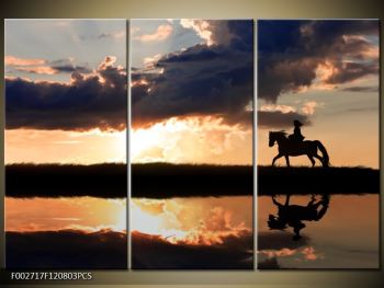 Obraz jezdce na koni při západu slunce 