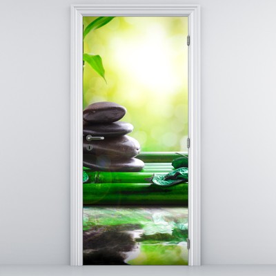 Fototapeta na drzwi - Kamienie do masażu i orchidea na wodzie