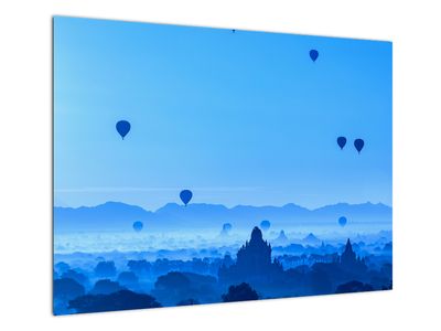 Glasbild - Luftballons über der Landschaft