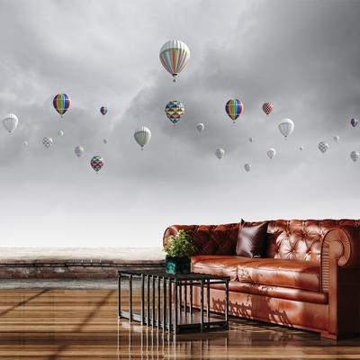 Fotobehang - Luchtballonnen boven een bakstenen muur